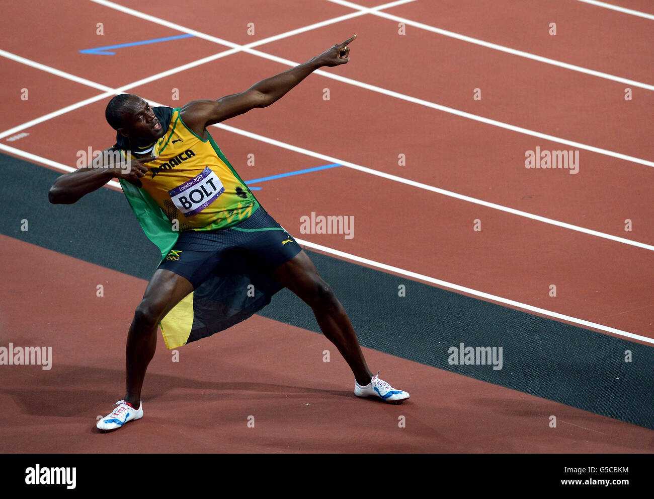 London Olympic Games - Day 9. Jamaica's Usain Bolt celebrates winning the men's 100m final on day nine of the Olympic Games at the Olympic Stadium, London. Stock Photo
