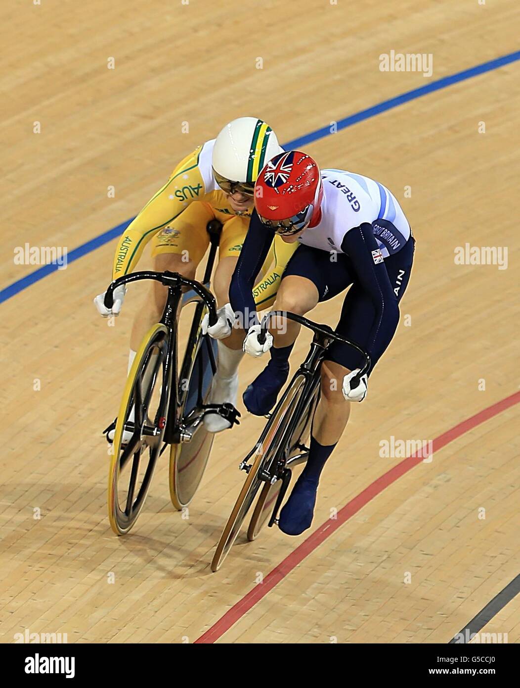 Great Britain's Victoria Pendleton (right) makes contact with Australia's Anna Meares in the Women's Sprint Final Race 1 in the Velodrome at the Olympic Park, on the eleventh day of the London 2012 Olympics. Stock Photo