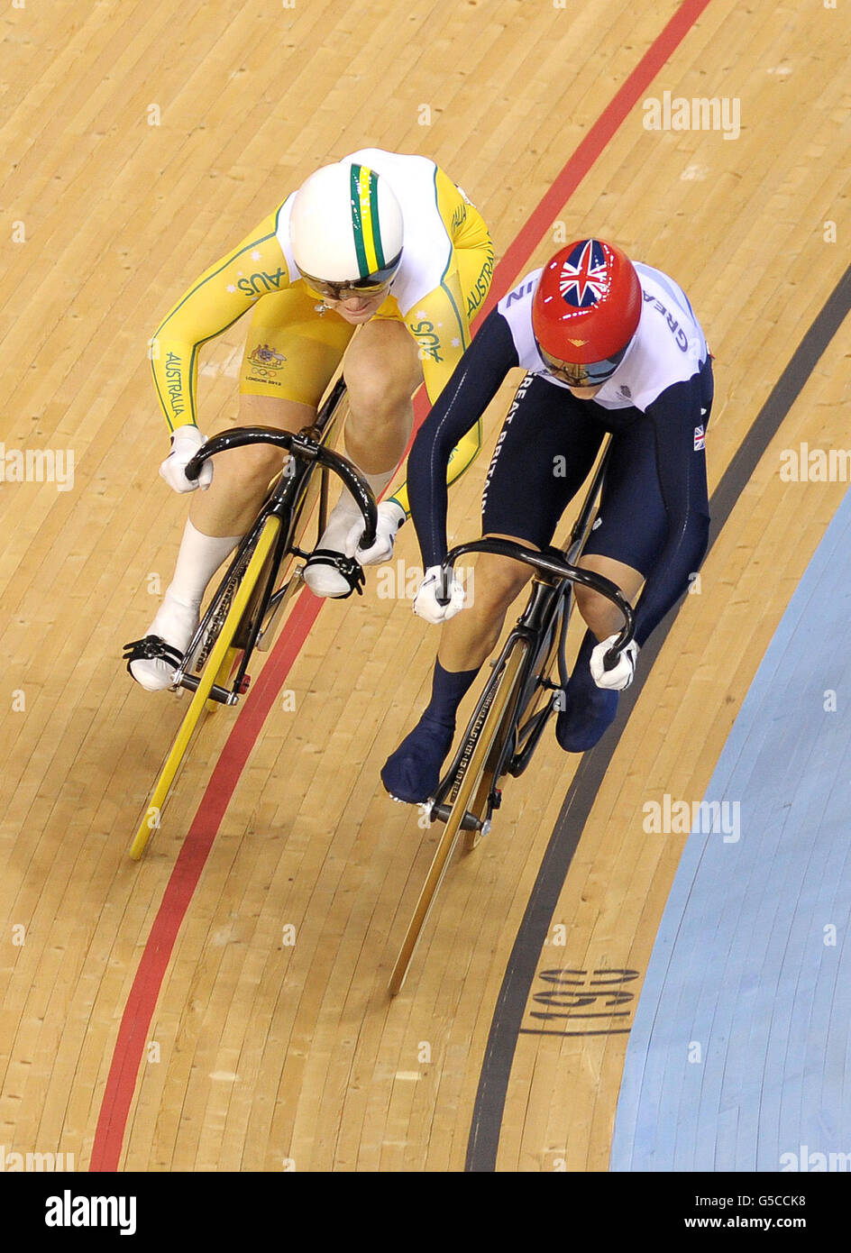 Great Britain's Victoria Pendleton (right) races with Australia's Anna Meares in the Women's Sprint Final Race 1 in the Velodrome at the Olympic Park, on the eleventh day of the London 2012 Olympics. Stock Photo