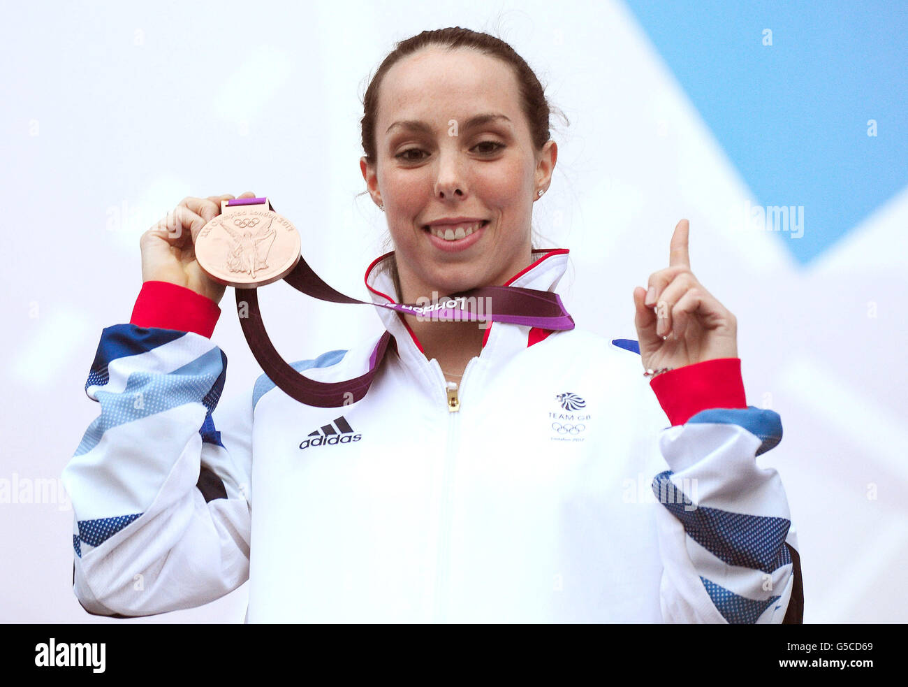 Beth Tweddle shows off her Bronze Medal won in the Women's Uneven Bars