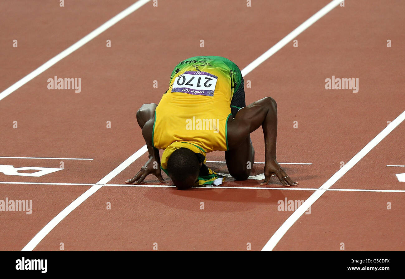 London Olympic Games - Day 13. Jamacia's Usain Bolt celebrates winning the men's 200m Final at the Olympic Stadium, London. Stock Photo