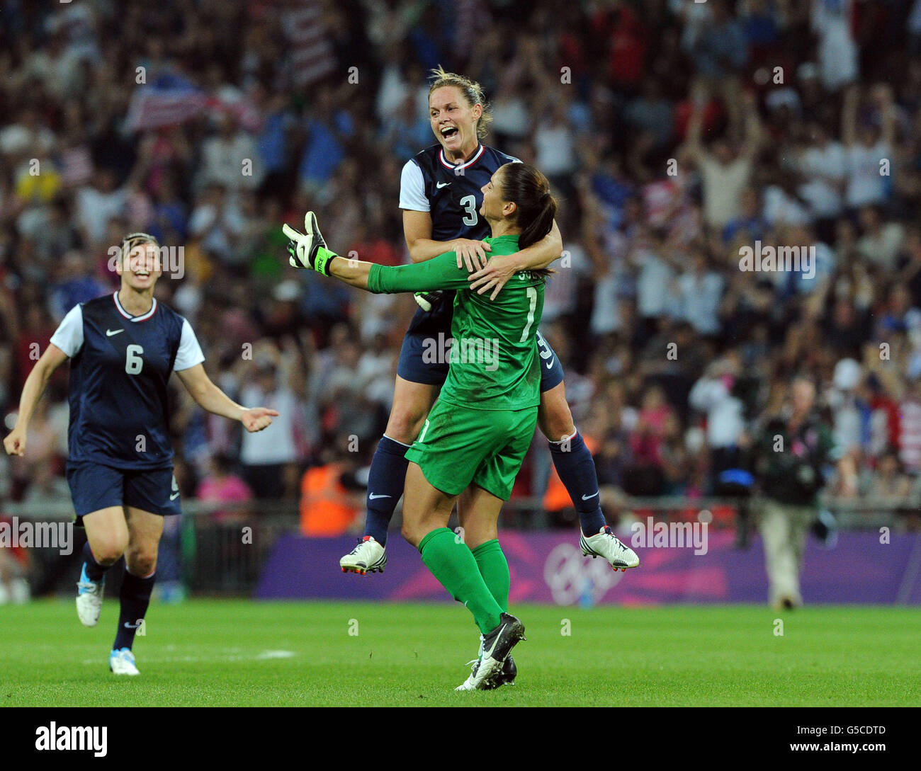 USA's Christine Rampone celebrates with Hope Solo after defeating Japan during the women's football final at Wembley Stadium, London. Stock Photo