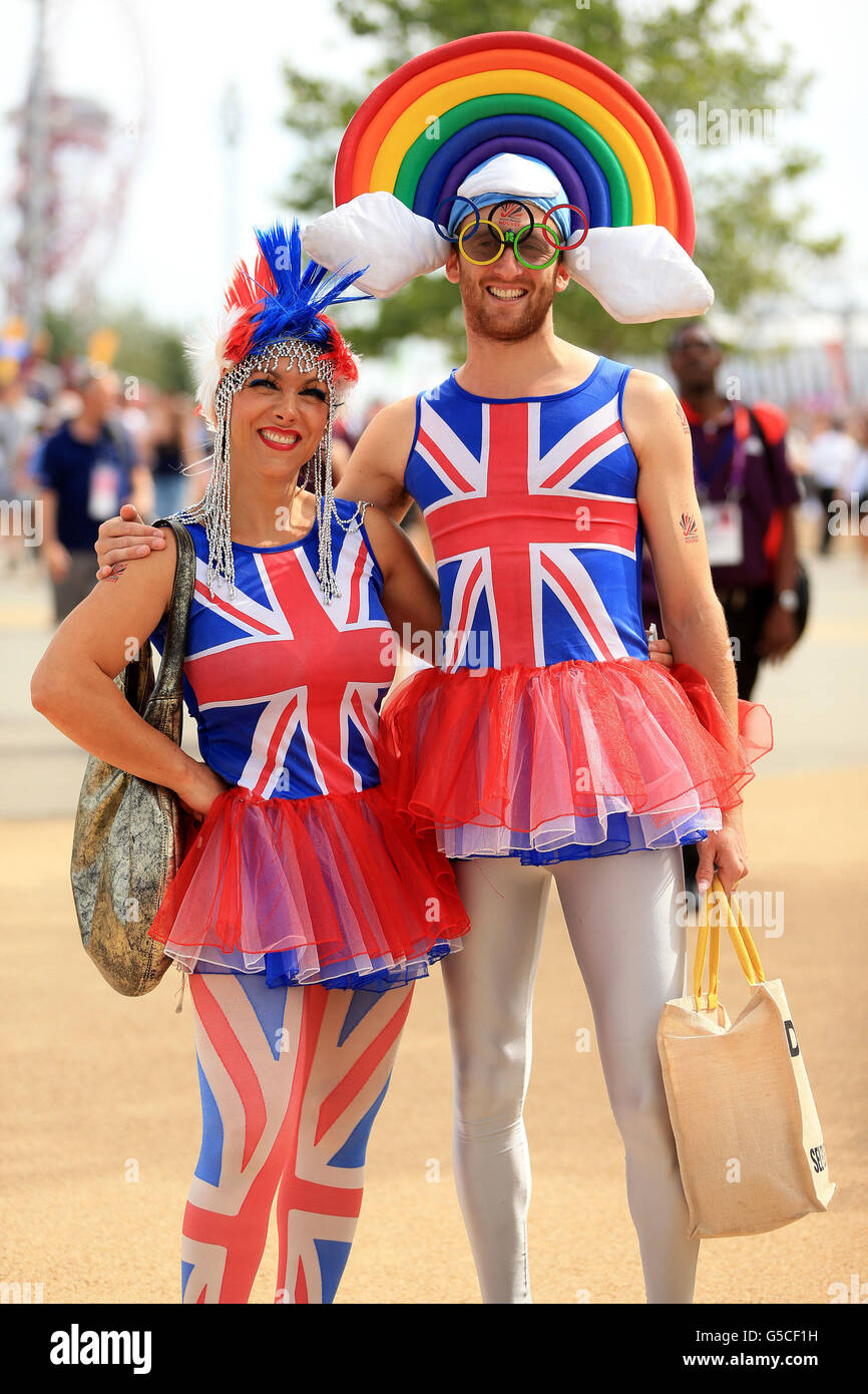 London Olympic Games - Day 15. Erika Isaac and Sam Djavit from London wear union jack clothes in the Olympic Park, London. Stock Photo