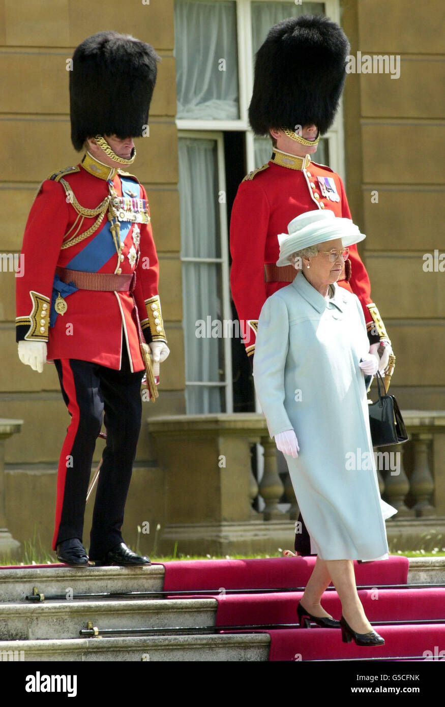 Britain's Queen Elizabeth II and the Duke of Edinburgh, left, before presenting new Colours to Nijmegen Company of the Grenadier Guards in the grounds of Buckingham Palace. *...The Queen also welcomed veterans of the Second World War battle, from which the guards took their name, to the palace grounds where they witnessed the ceremonial presentation of the new flag. Stock Photo