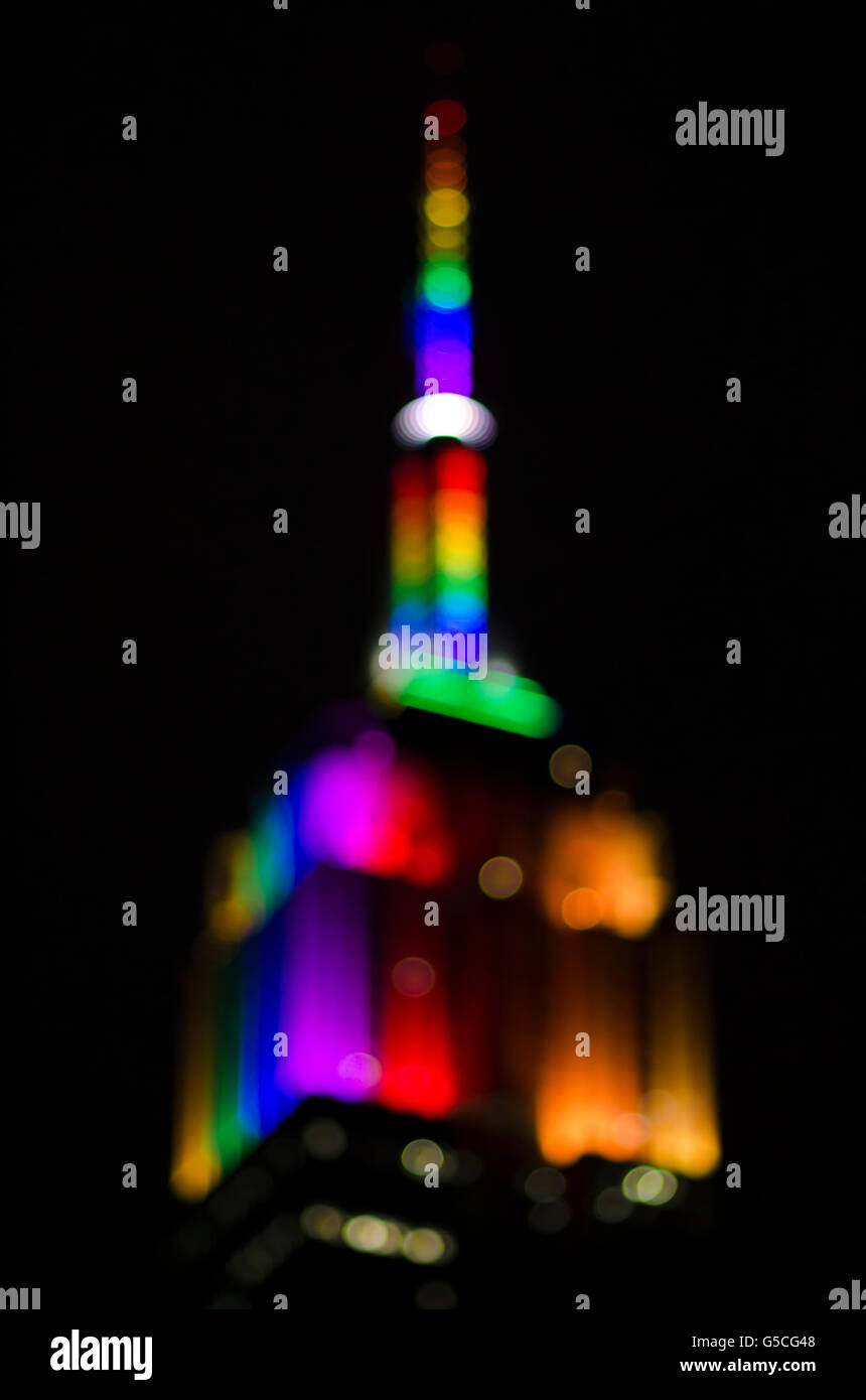 NEW YORK CITY, USA - JUNE 28, 2015: The Empire State Building glows rainbow colors in honor of NYC Pride Week. Stock Photo
