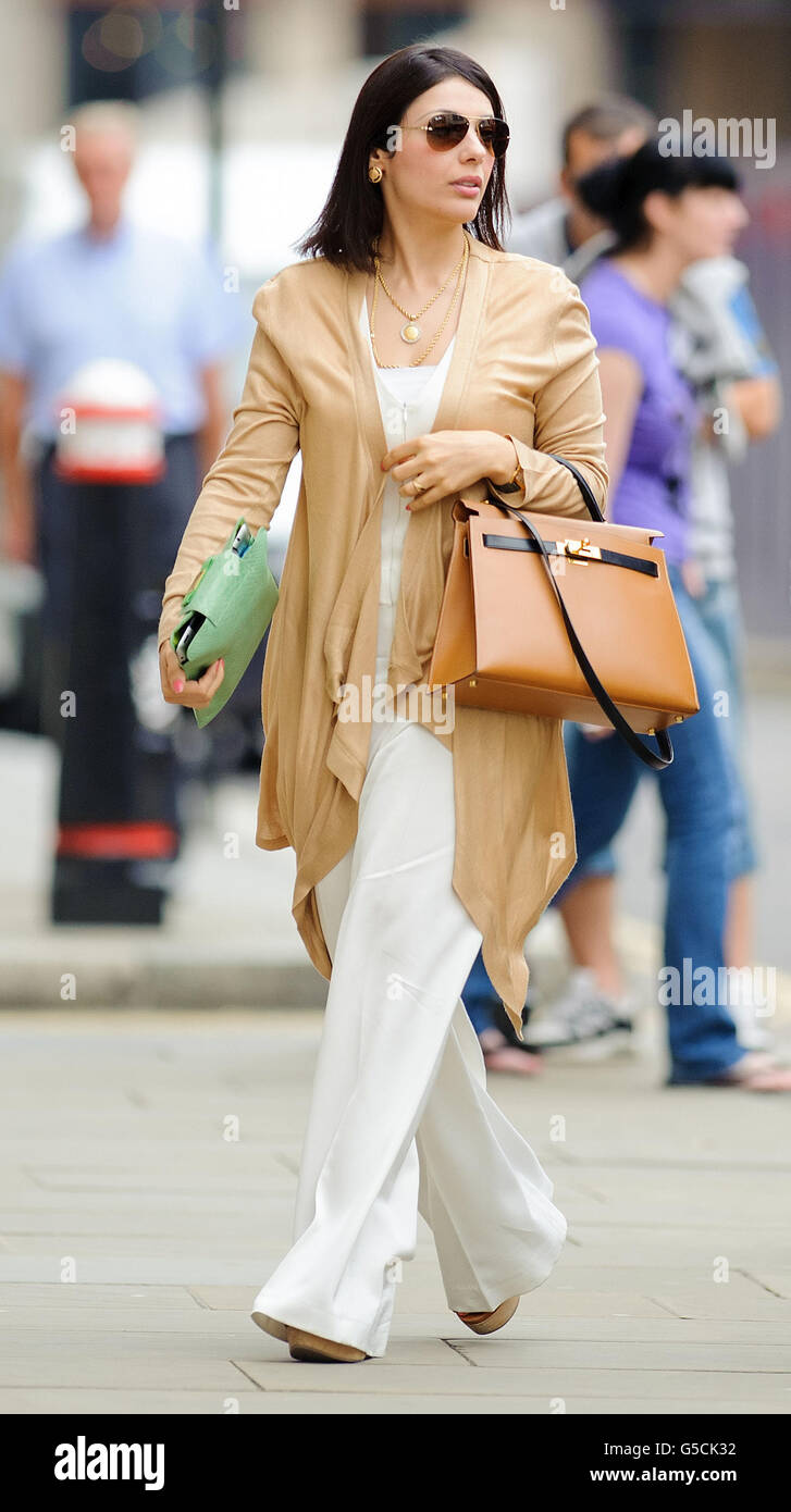 Nur Nadil, the wife of former fugitive tycoon Asil Nadir, arrives at the Old Bailey, central London, as the jury will continue deliberating on nine charges against him today - the day after they left him facing a prison sentence for plundering millions from his Polly Peck business empire. Stock Photo