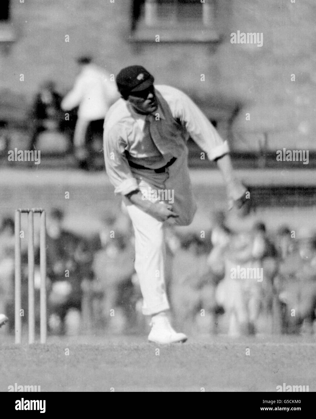 1923: Rhodes, the veteran of the Yorkshire team bowling. Stock Photo