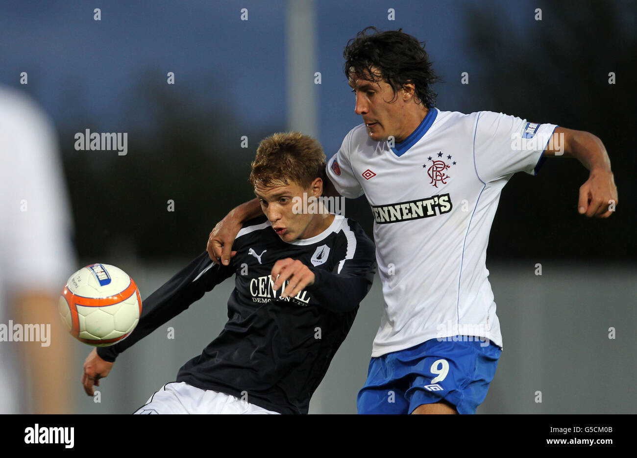 Falkirk's Blair Alston and Rangers' Francisco Sandaza (right) battle for the ball during the Ramsdens Cup Second Round match at Falkirk Stadium, Falkirk. Stock Photo