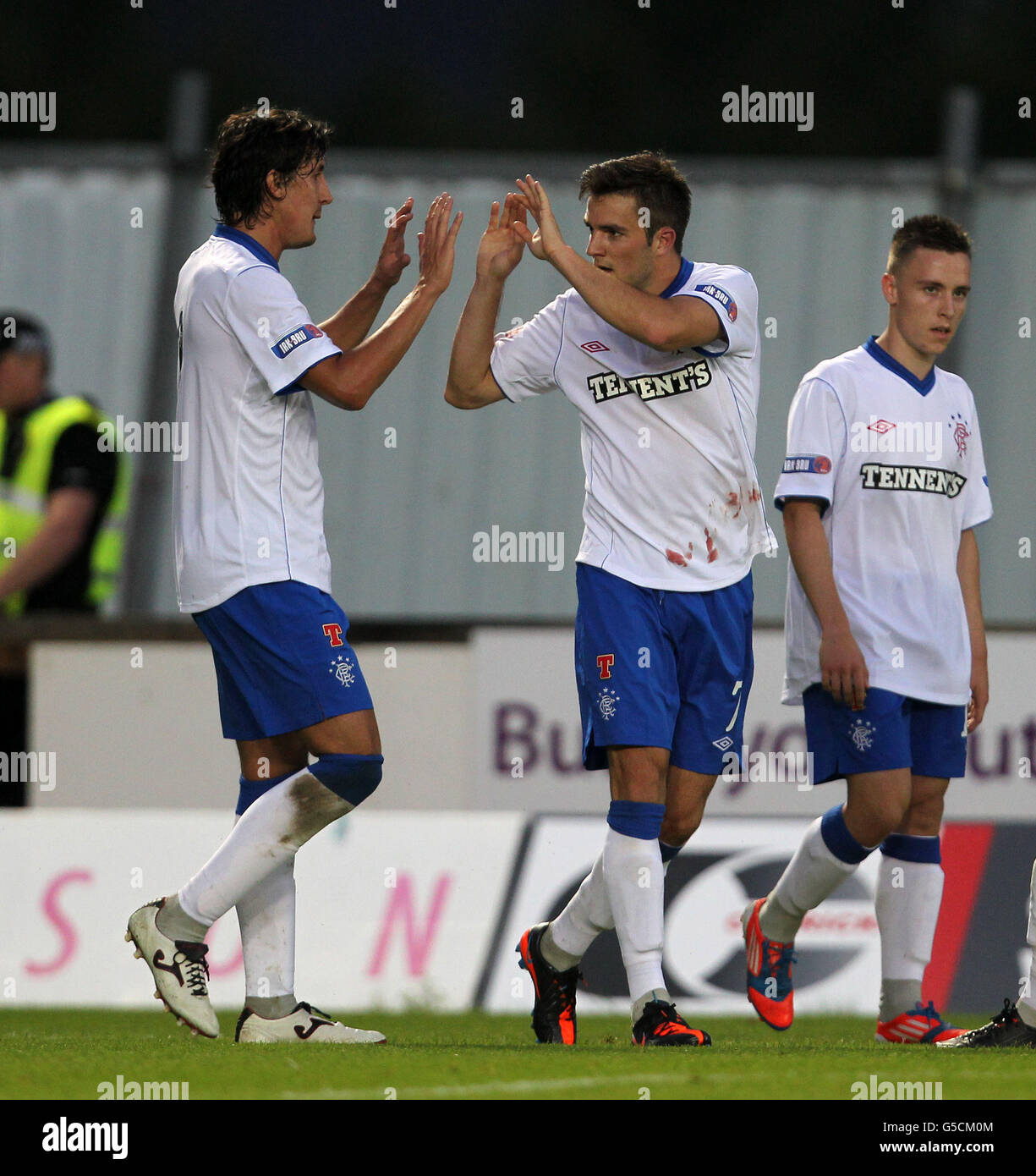 Ranger's Andy Little (centre) celebrates scoring with Francisco Sandaza ...