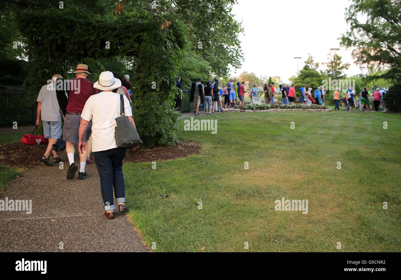 People leaving after an outdoor concert Stock Photo
