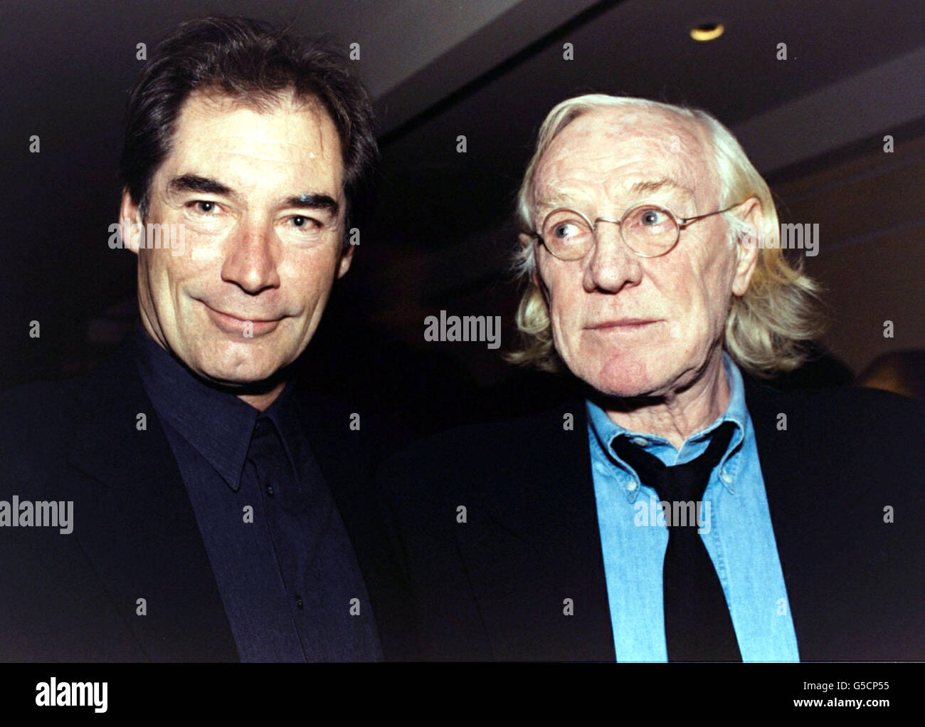 Actor Timothy Dalton (left, who starred in the movie) with Richard Harris at a reception at The Washington Hotel in Mayfair, London, prior to the world premiere screening of a newly-restored print of the 1968 film 'The Lion in Winter'. Stock Photo