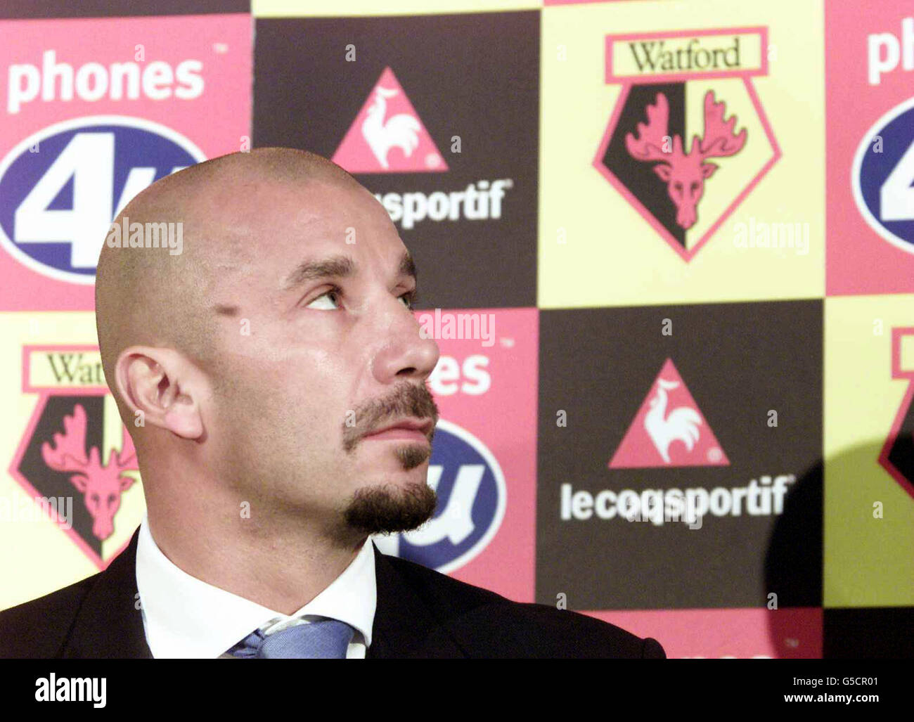 Watford's new manager Gianluca Vialli listens to the club chairman Sir Elton John during a press conference at Vicarage Road, Watford. The former Chelsea boss will take over at the end of the season when Graham Taylor retires. * The Hornets represent Vialli s first job in management since his unexpected exit at Stamford Bridge eight months ago. Stock Photo