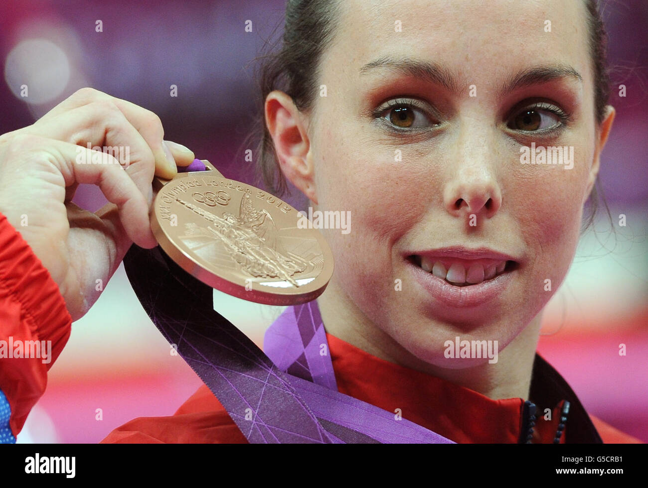Great Britain's Beth Tweddle celebrates with her Bronze medal after the Women's Uneven Bars