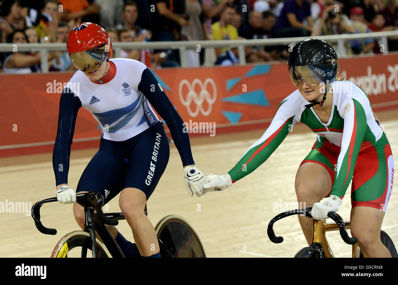 Great Britain's Victoria Pendleton after winning her Women's Sprint Quarter Final with Belarus's Olga Panarina (right) on day Ten of the Olympic Games at the Velodrome in London. Stock Photo