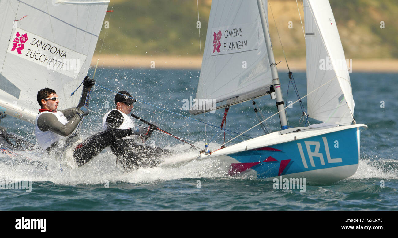 London Olympic Games - Day 10. Ireland's Men's 470 team of Ger Owens and Scott Flanigan race upwind during the Olympics on Weymouth Bay. Stock Photo