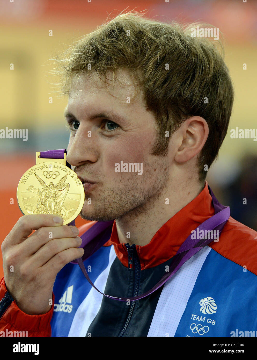 Great Britain's Jason Kenny celebrates with his gold medal after