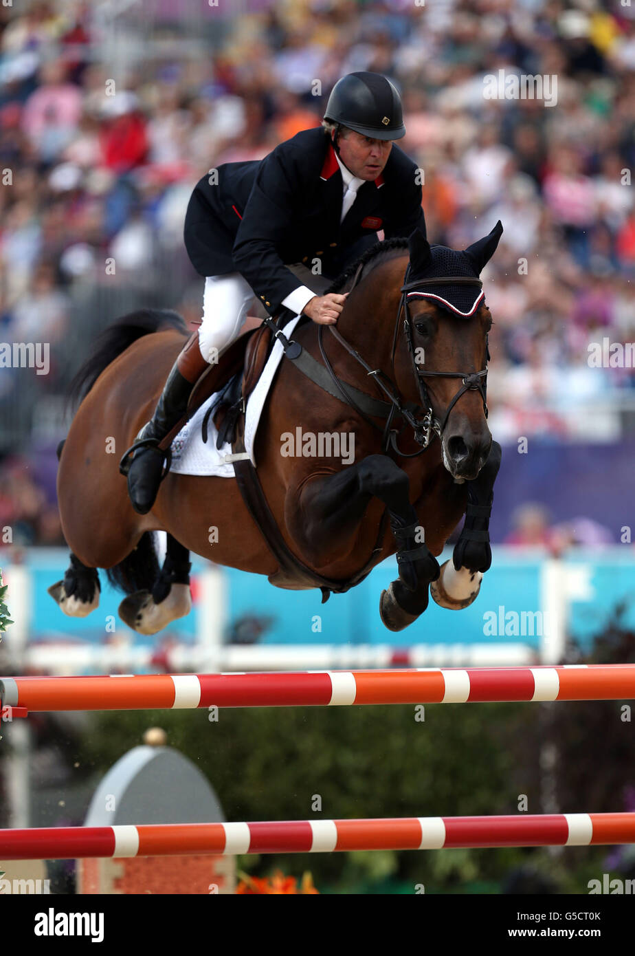 Great Britain's Nick Skelton riding Big Star during the Equestrian Team Jumping, at Greenwich Park, during day ten of the London 2012 Olympics. Stock Photo