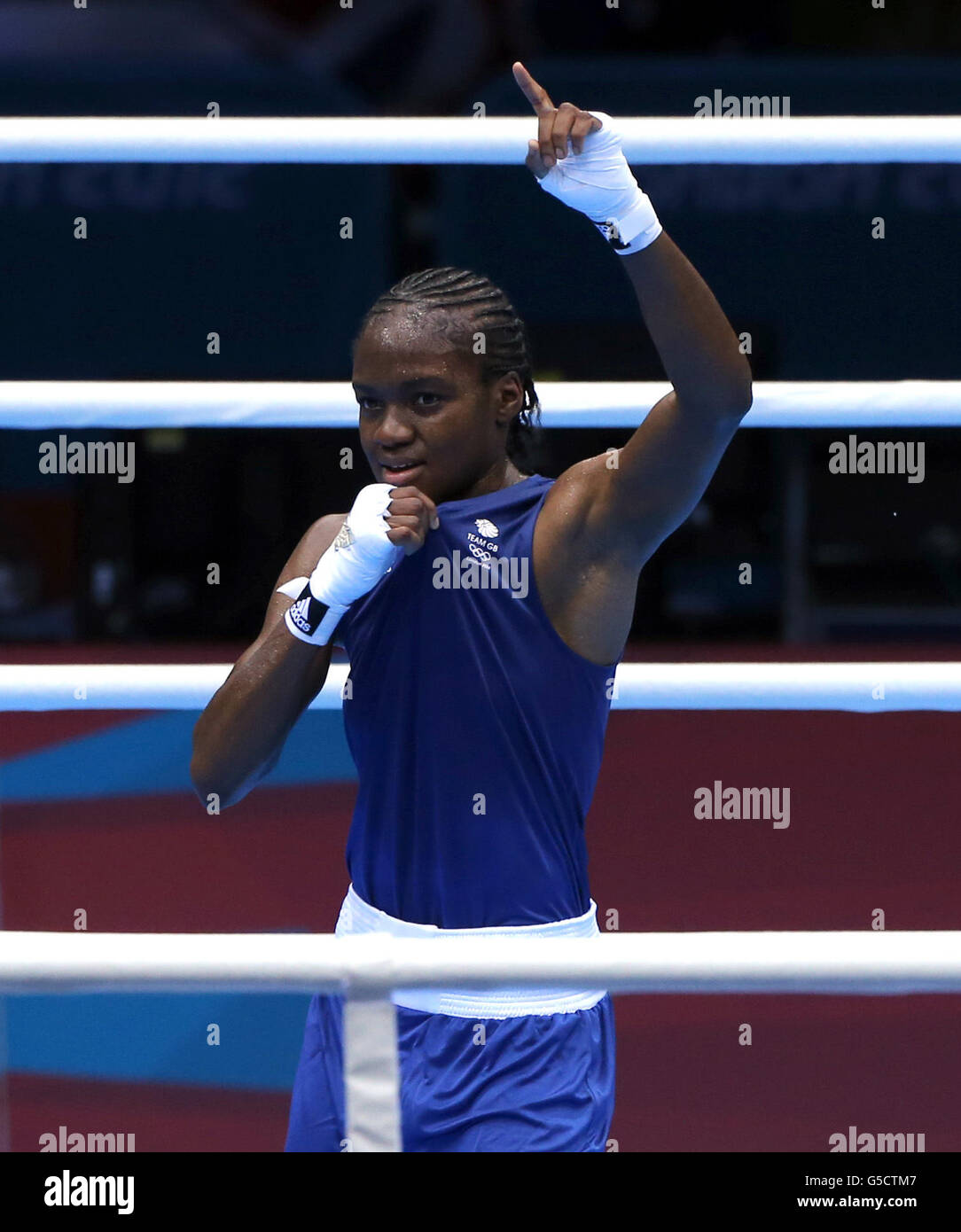 Great Britain's Nicola Adams defeats India's Chungneijang Mery Kom Hmangte during the Women's Boxing Fly (48-51kg) Semi Final at the ExCel centre, London, on the twelfth day of the London 2012 Olympics. Stock Photo