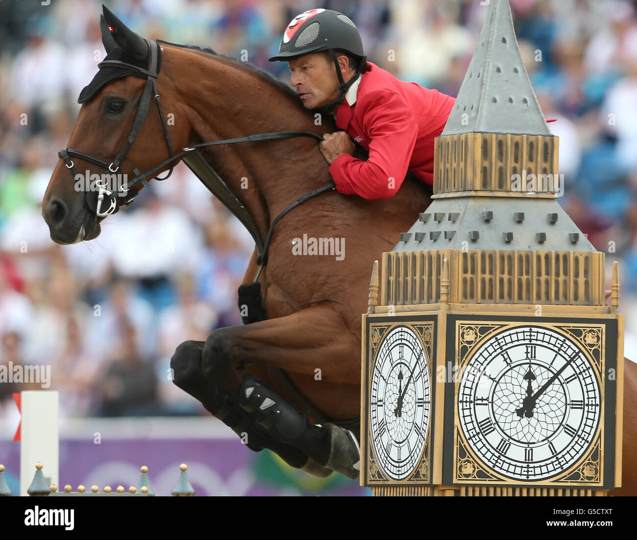 Switzerland's Pius Schwizer on Carlin IV during the Individual jumping final round a at Greenwich Park during the London 2012 Olympics Stock Photo