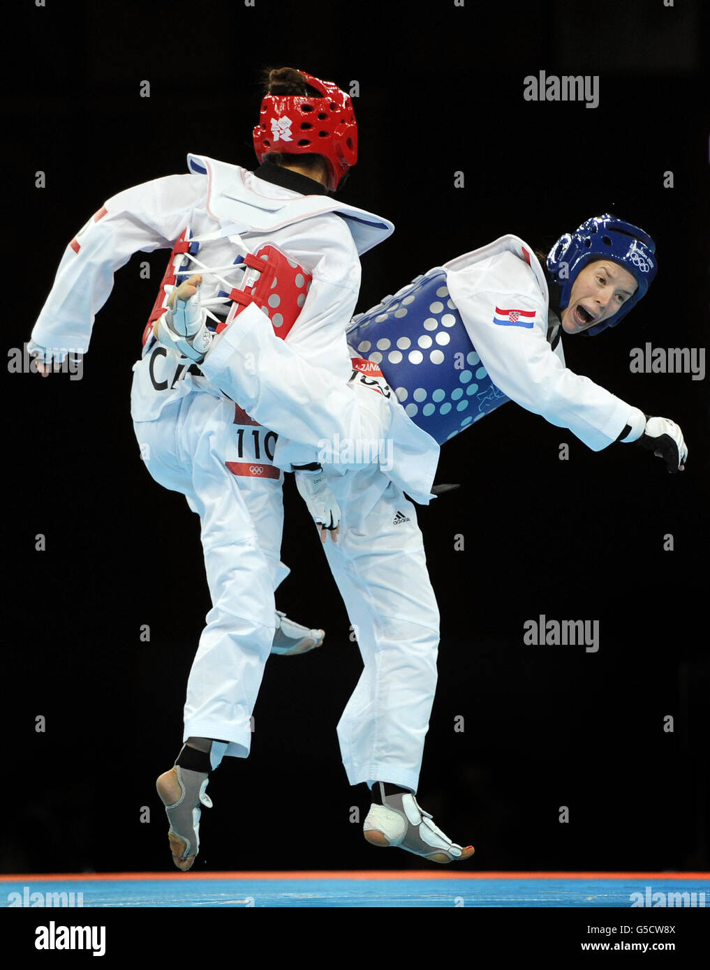 Central African republic's Seulki Kang (red) competes against Croatia's Lucija Zaninovic during the Women's (-49kg) Taekwondo at the ExCel centre, London Stock Photo
