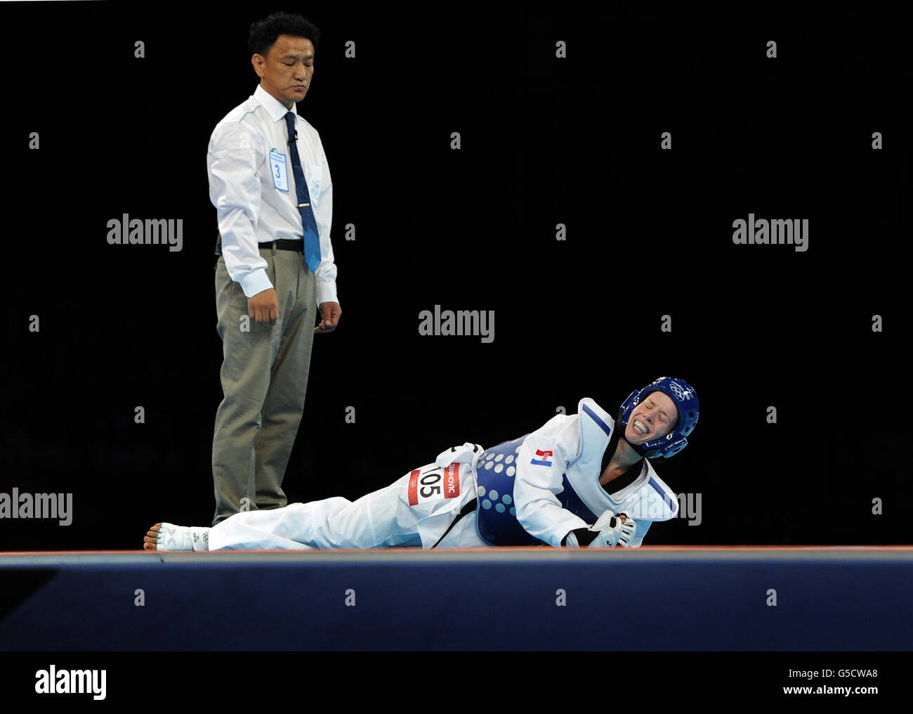 Croatia's Lucija Zaninovic reacts after being knocked down as she competes against Central African republic's Seulki Kang during the Women's (-49kg) Taekwondo at the ExCel centre, London Stock Photo