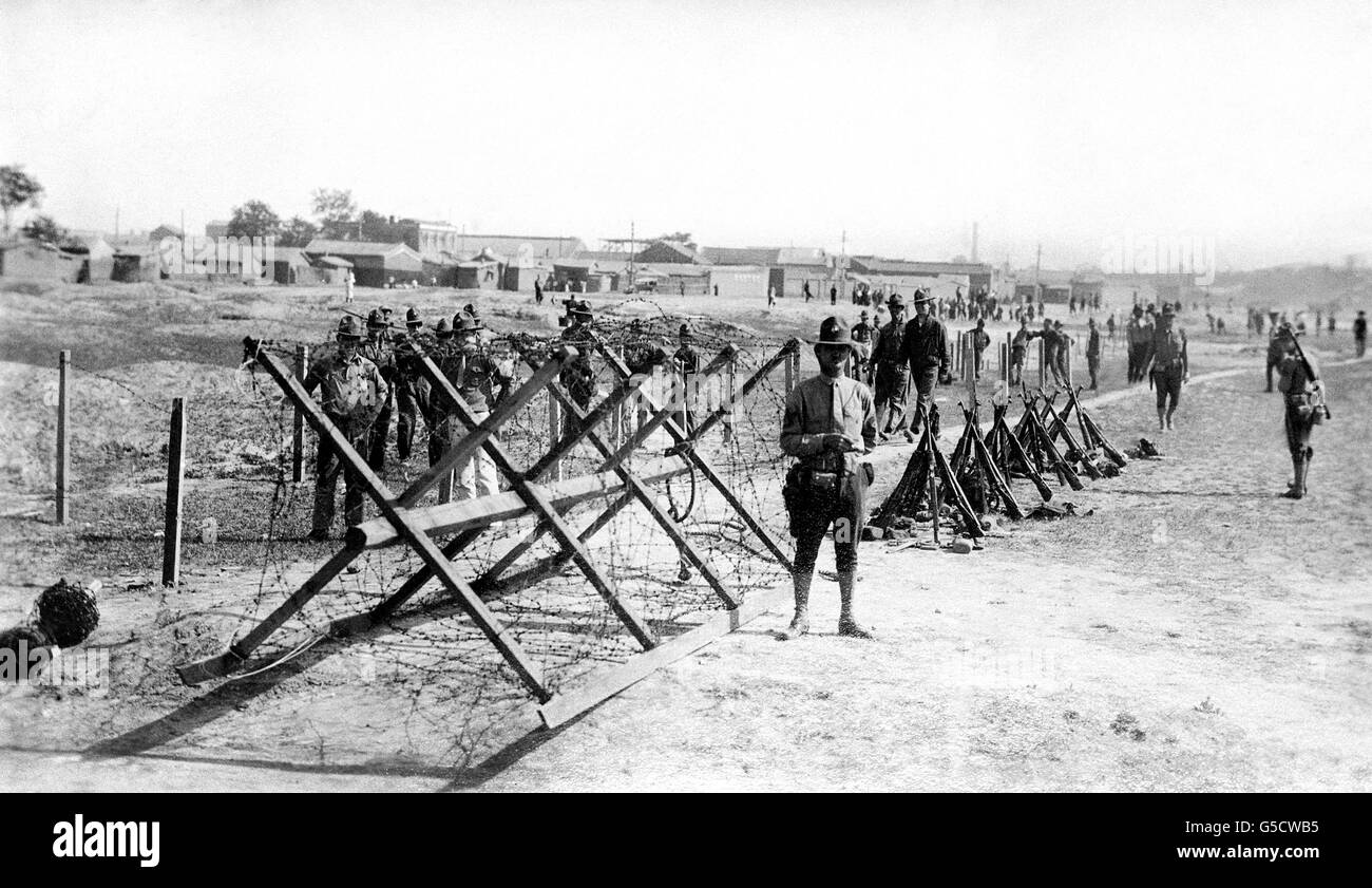 American marines construct a strong barbed wire defence system at their base at the Tientsin Racecourse. Stock Photo