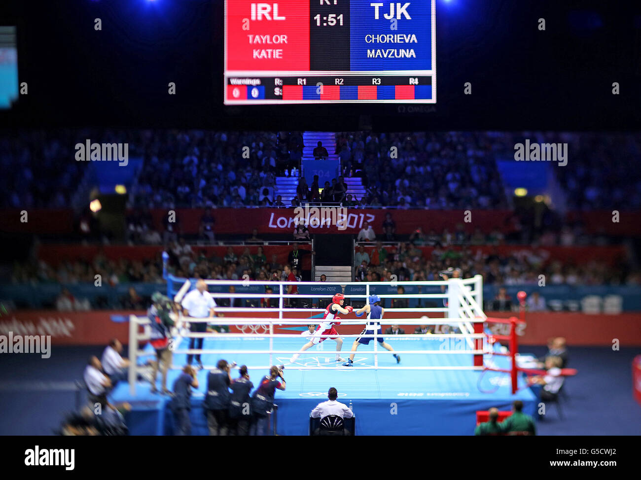 Ireland's Katie Taylor (red) in action in her Women's Boxing Lightweight 60kg bout against Mavzuna Chorieva in London's Excel Arena during the 2012 Olympic Games. Stock Photo