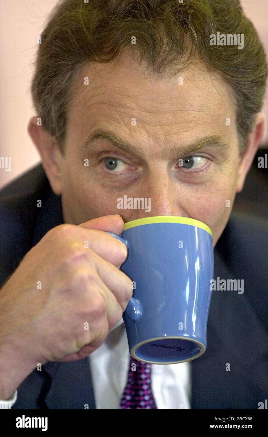British Prime Minister Tony Blair enjoys a cup of tea during a visit to Robin Hood Junior and Infants school Hall Green, Birmingham. Blair launched the Labour Party's General Election manifesto. 26/10/2004 Researchers at Newcastle University's Medicinal Plant Research Centre have discovered that drinking regular cups of tea could help improve memory. The findings, which are published in the academic journal Phytotherapy Research, may lead to the development of a new treatment for Alzheimer's - a form of dementia that affects an estimated 10 million people worldwide. Stock Photo
