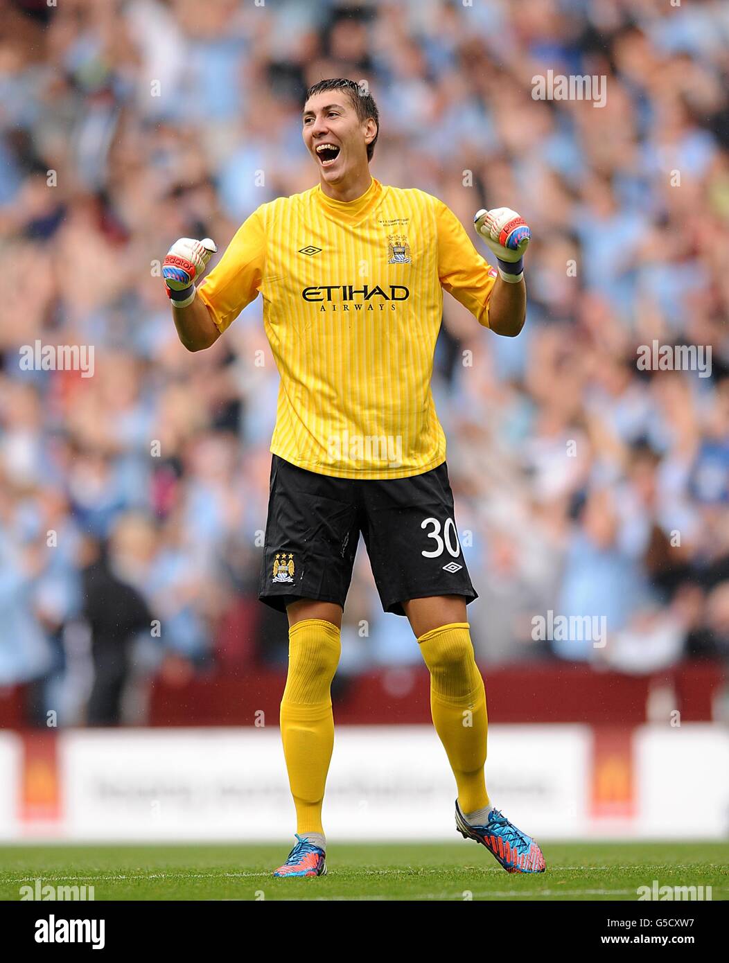 Manchester City goalkeeper Costel Pantilimon celebrates their third goal  scored by team-mate Samir Nasri Stock Photo - Alamy