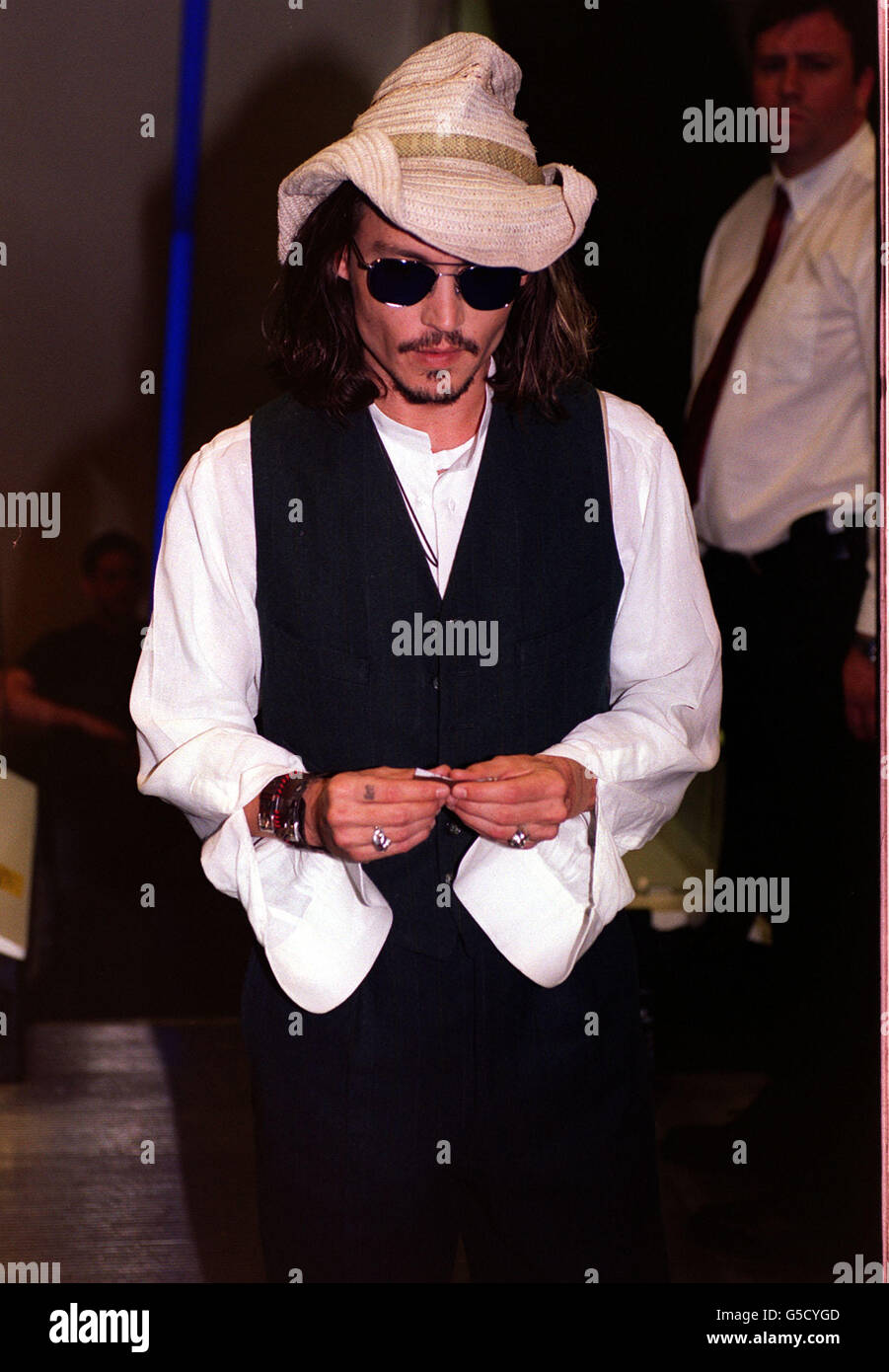 Actor Johnny Depp, 37, rolls a cigarette as he arrives for the premiere of his latest film Blow, based on the true story of a notorious drug smuggler, in London's Leicester Square. * To perfect his role as cocaine importer George Jung, Depp met up with the shady character who helped to flood the US with the drug in the 1970s. The film opens across the UK on May 25, 2001. Stock Photo