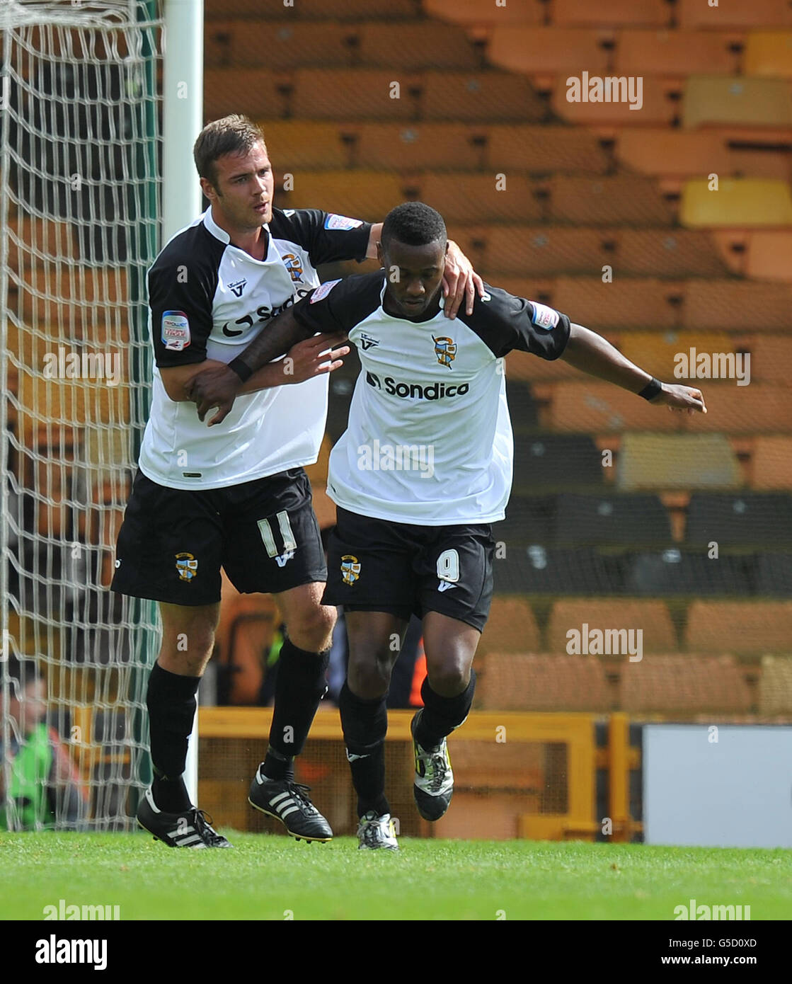 Port Vale's Jennison Myrie-Williams is congratulated on scoring his team's second goal by team mate Tom Pope during the npower League Two match at Vale Park, Stoke On Trent. Stock Photo