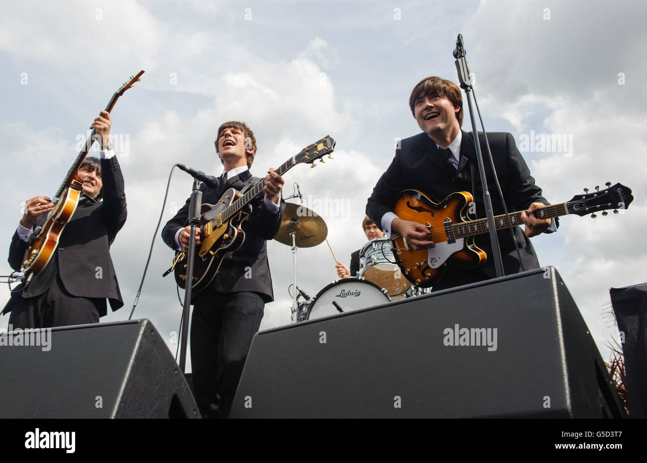 Cast members of the new Beatles musical 'Let It Be' (left to right) Emanuelle Angeletti as Paul McCartney, Stephen Hill as George Harrison, Gordon Elsmore as Ringo Starr (back, part obscured) and Reuven Gershon as John Lennon perform during a photocall at the Trafalgar Hotel, central London. Stock Photo