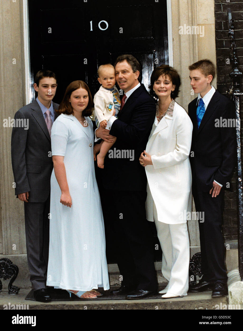 Prime Minister Tony Blair poses with his youngest son Leo, wife Cherie