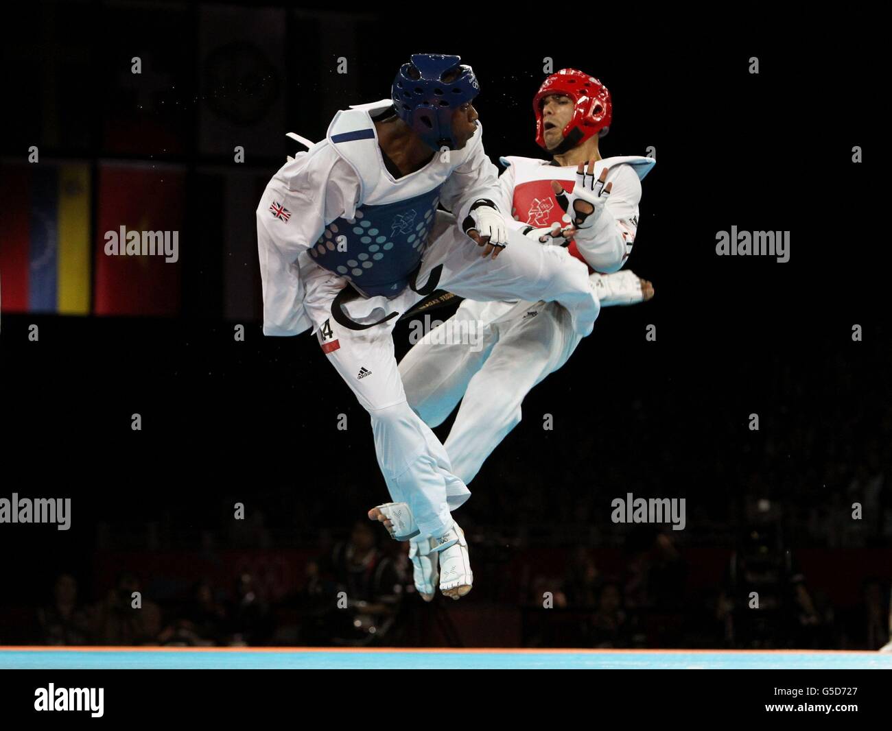 Great Britain's Lutalo Muhammad (left) competes against Iran's Yousef