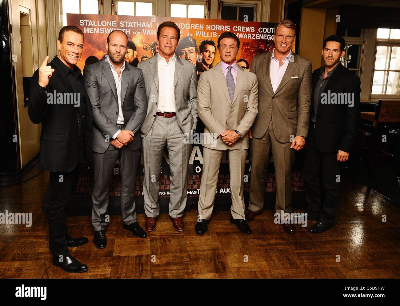 (left - right) Jean-Claude Van Damme, Jason Statham, Arnold Schwarzenegger, Sylvester Stallone, Dolph Lundgren and Scott Adkins at a photocall for new film The Expendables 2, at Simpsons-in-the-Strand, in central London. Stock Photo