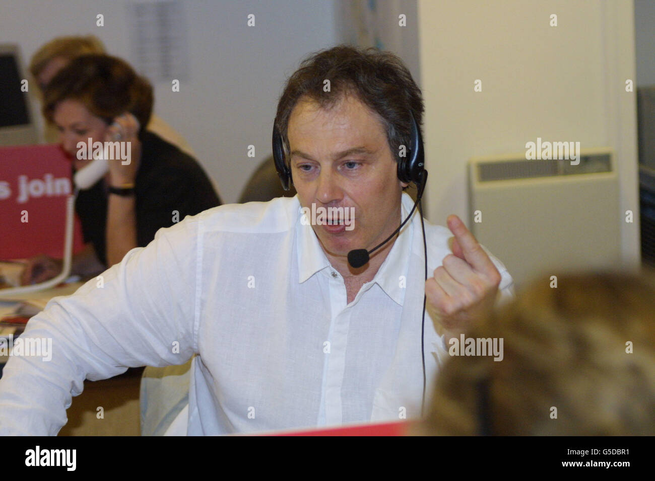 Prime Minister Tony Blair hosting a public phone-in regarding Labour's latest election broadcast, which was screened on national television, at Labour Party headquarters at Millbank Tower, in London. Stock Photo