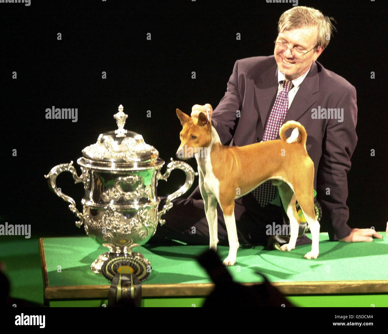 Jethard Cidevant, the Basenji known as Sid, with owner Paul Singleton from Colchester, Essex after being named a Supreme Champion at the Crufts dog show at the Birmingham National Exhibition Centre. Stock Photo