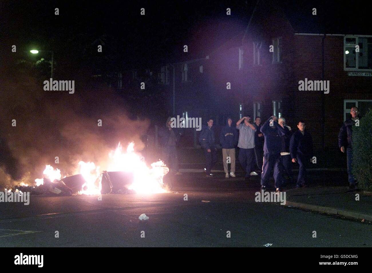 Oldham Riot Police White men stand beside a bonfire in Oldham, Greater Manchester, where ...
