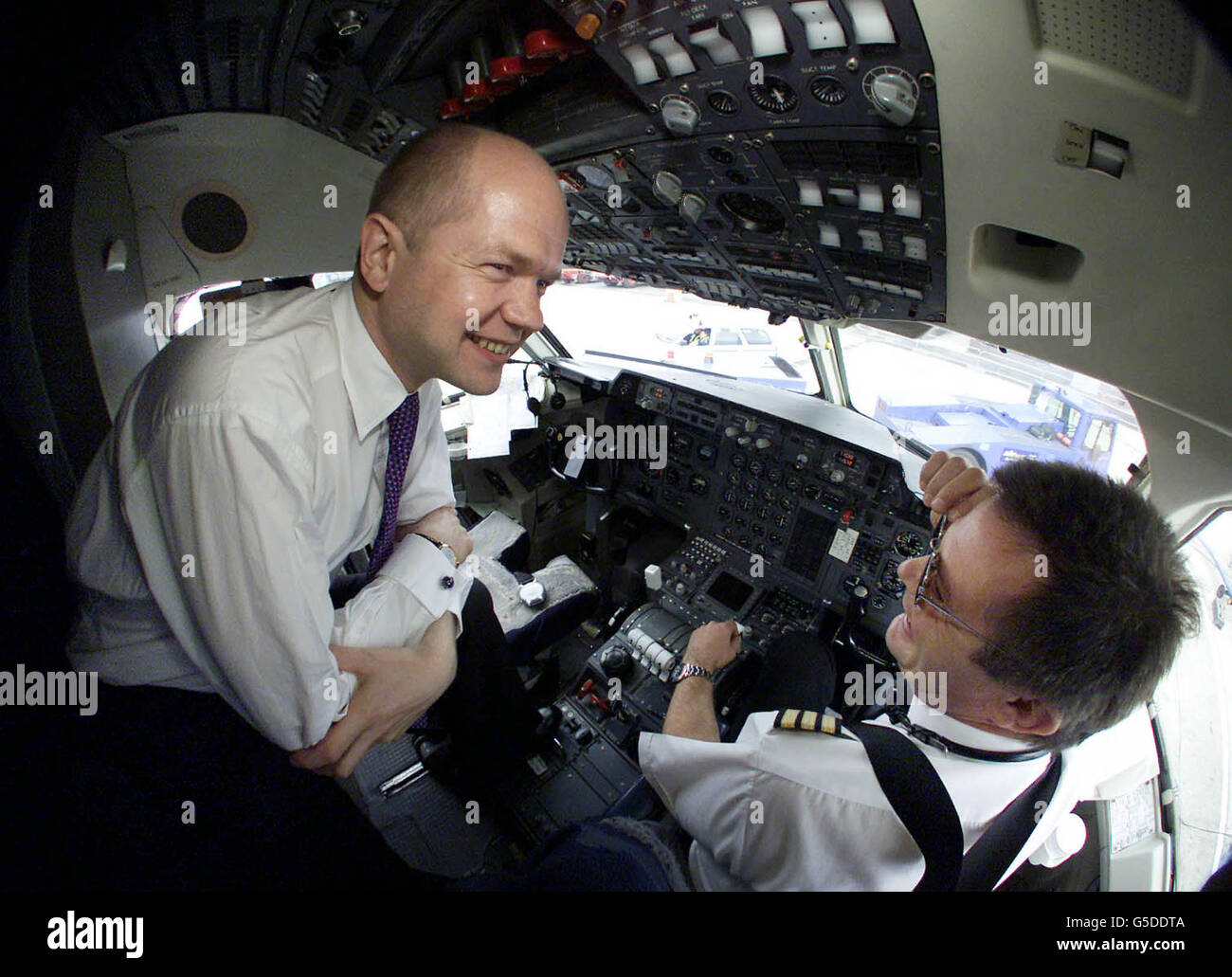 Conservative Party leader William Hague talks to First Officer Simon Stewart aboard his General Election campaign jet. In a keynote speech to an audience from the Asian community in Bradford Mr Hague sought to shake off the charge of racism. * ...that has dogged his party throughout the election campaign. He said: 'It has never mattered to me whether people are Muslim, Christian, Hindu, Sikh, Jewish, white, black or Asian. As far as I am concerned we are all as British as each other.' Mr Hague was speaking alongside the Tories' Muslim candidate for Bradford West, Mohammed Riaz. Stock Photo
