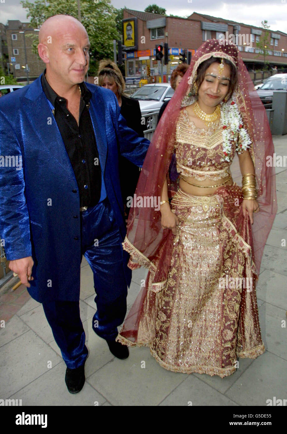 Dave Courtney and Saira Bronson, wearing a traditional Asian wedding gown, arrive at the Manhattan Cafe in Woolwich, south east London for a reception after her marriage to Britain's most dangerous inmate Charles Bronson, at Milton Keynes Prison. Stock Photo