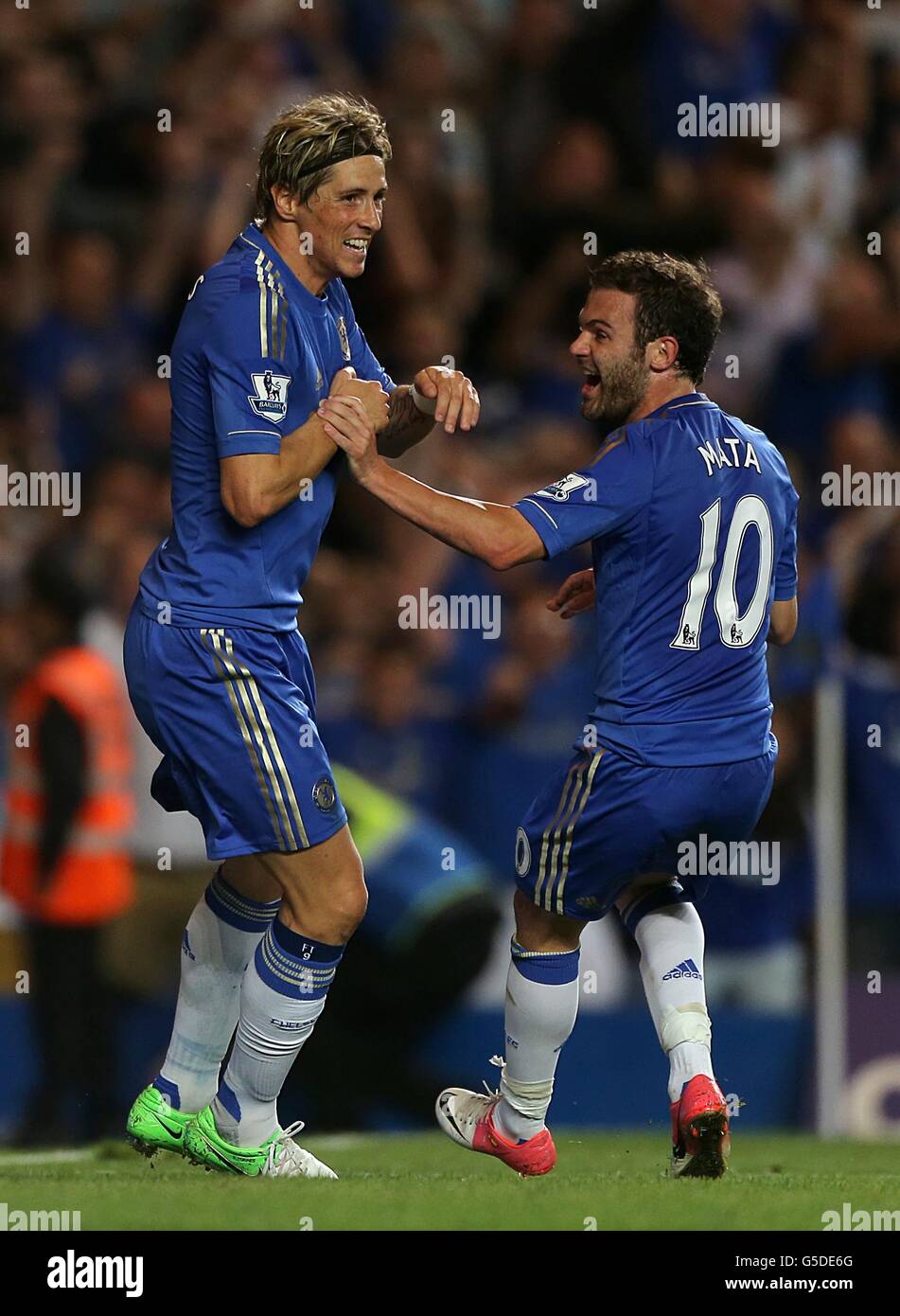 Chelsea's Fernando Torres celebrates scoring their third goal of the game with team-mate Juan Mata (right) Stock Photo