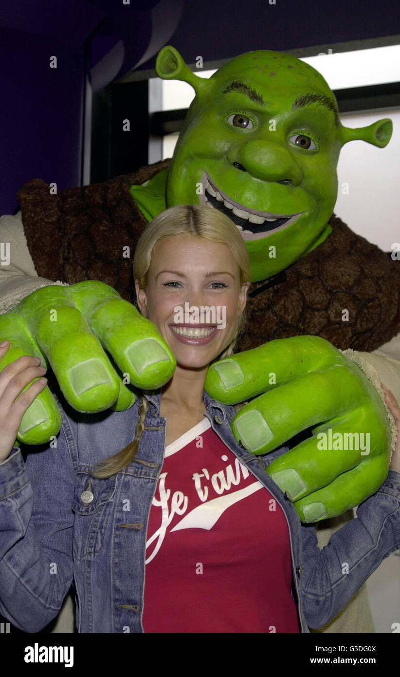 TV presenter Melinda Messenger gets a hug from the star of 'Shrek', at a celebrity screening of the new animated film from the Dreamworks studio, at the Warner West End Cinema, London. Stock Photo