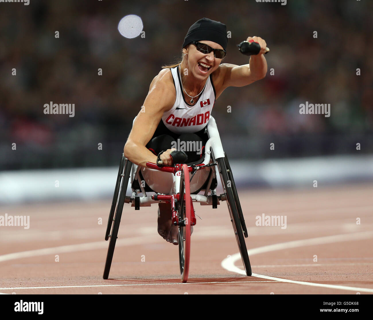 Canadas michelle stilwell celebrates winning womens 200m t52 final hi