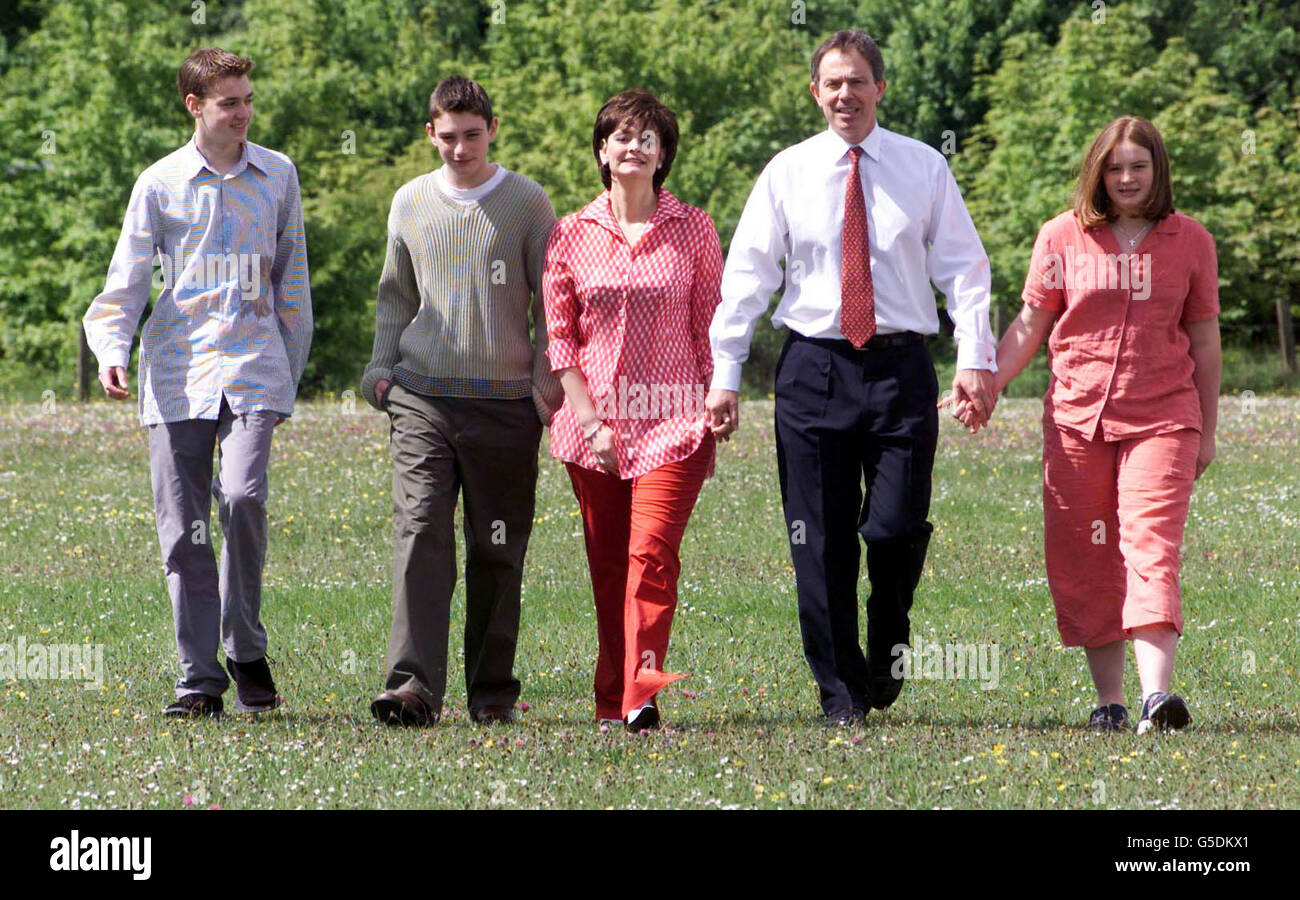 Prime Minister Tony Blair arrives with his wife Cherie and children