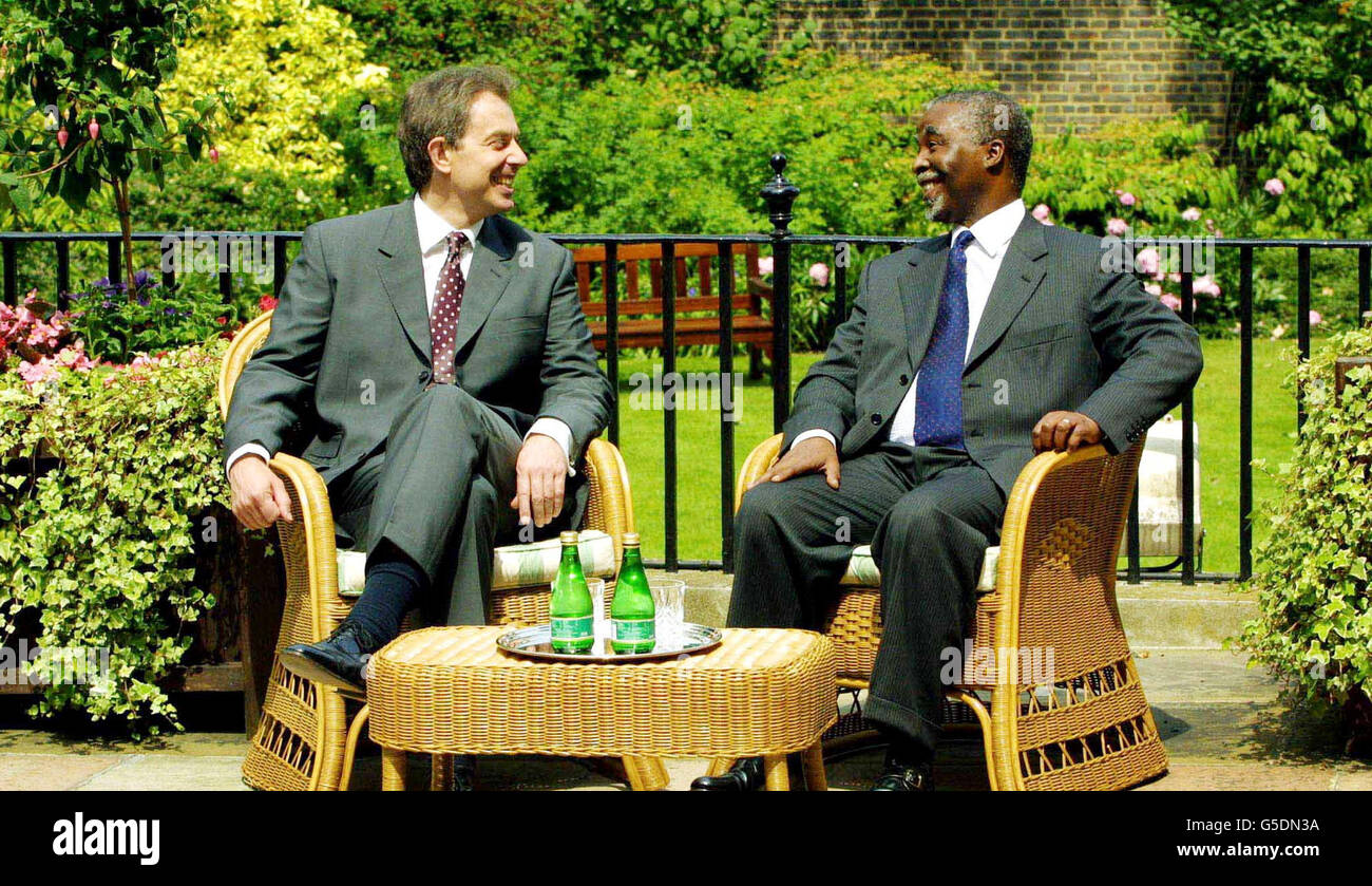 Prime Minister Tony Blair (L) talks with Thabo Mbeki, President of the Republic of South Africa in the garden at No.10 Downing Street in London. Mbeki is on a four-day official state visit to Britain. Stock Photo