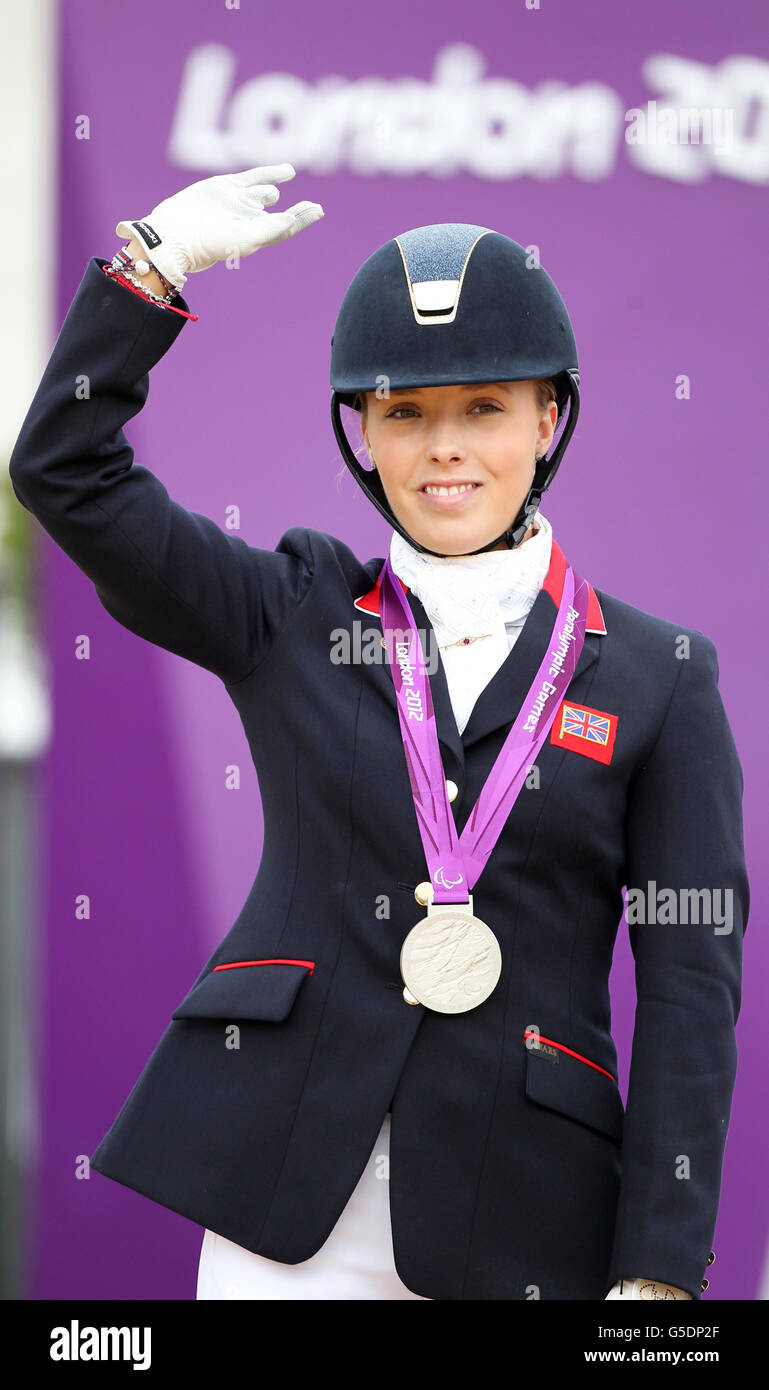 Great Britain's Sophie Wells celebrates her silver medal after riding ...