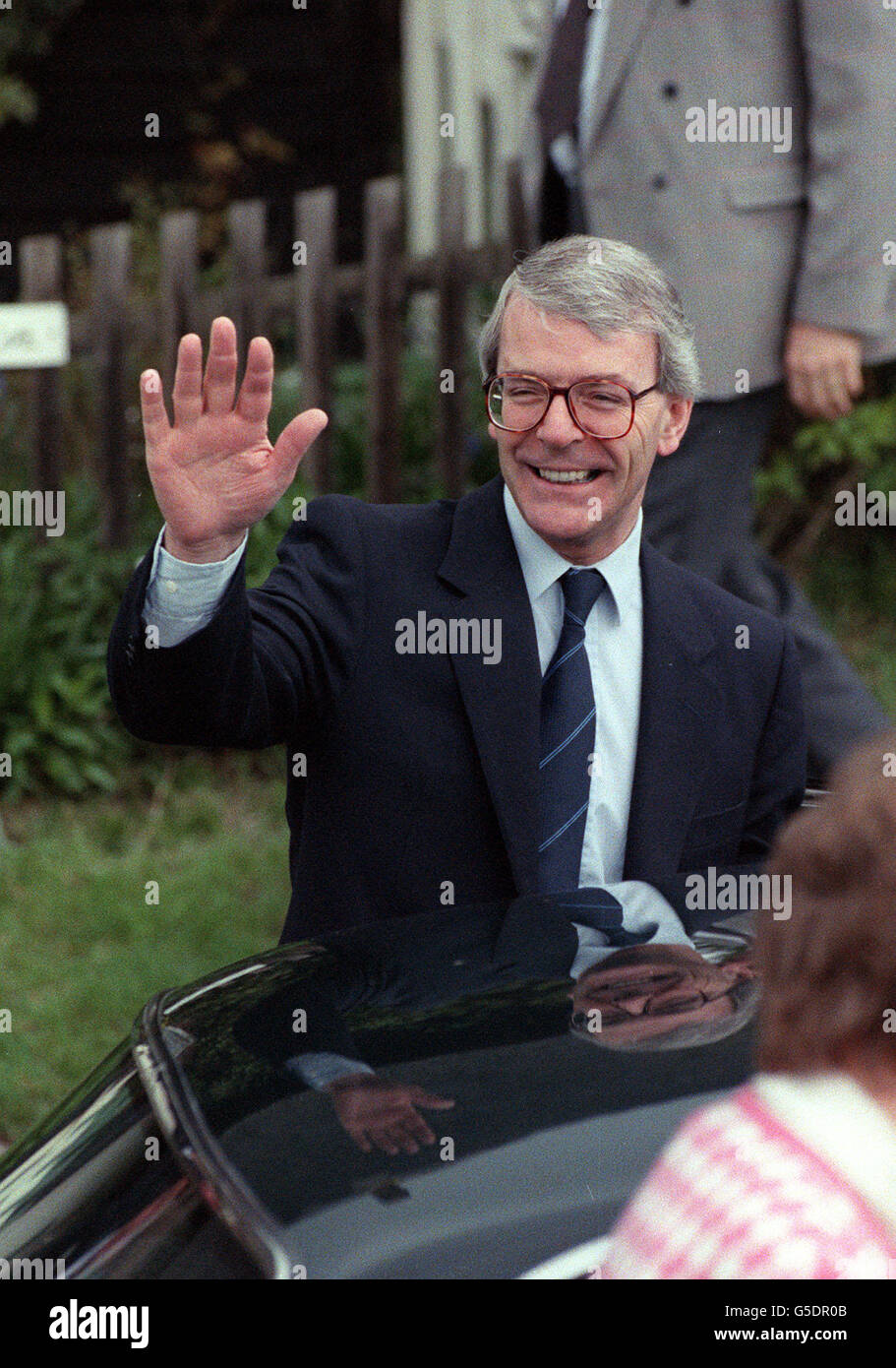 Prime Minister John Major waves to the crowd after attending morning service at the Church of St Peter and St Paul Ellesborough. Stock Photo