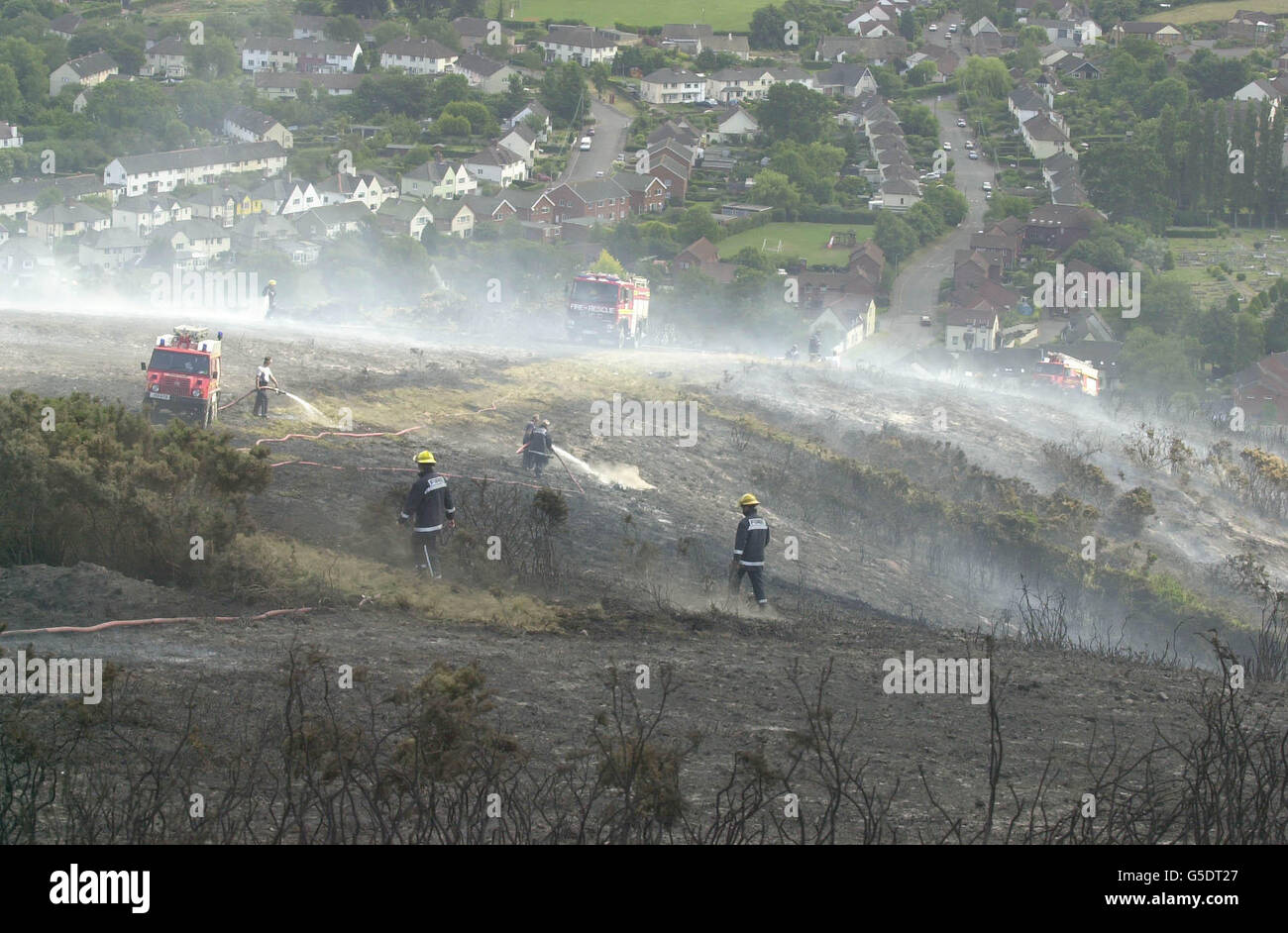 Fire crews battling with rising winds as they try to control a heathland blaze which has destroyed around 30 acres spreading across gorse and heathland on North Hill beauty spot that overlooks Minehead, Somerset. Holidaymakers on a campsite near the blaze were evacuated. *The blaze broke out over four acres of gorse, with fire crews and specialist units from Somerset and neighbouring Devon working to control it through the night. Stock Photo