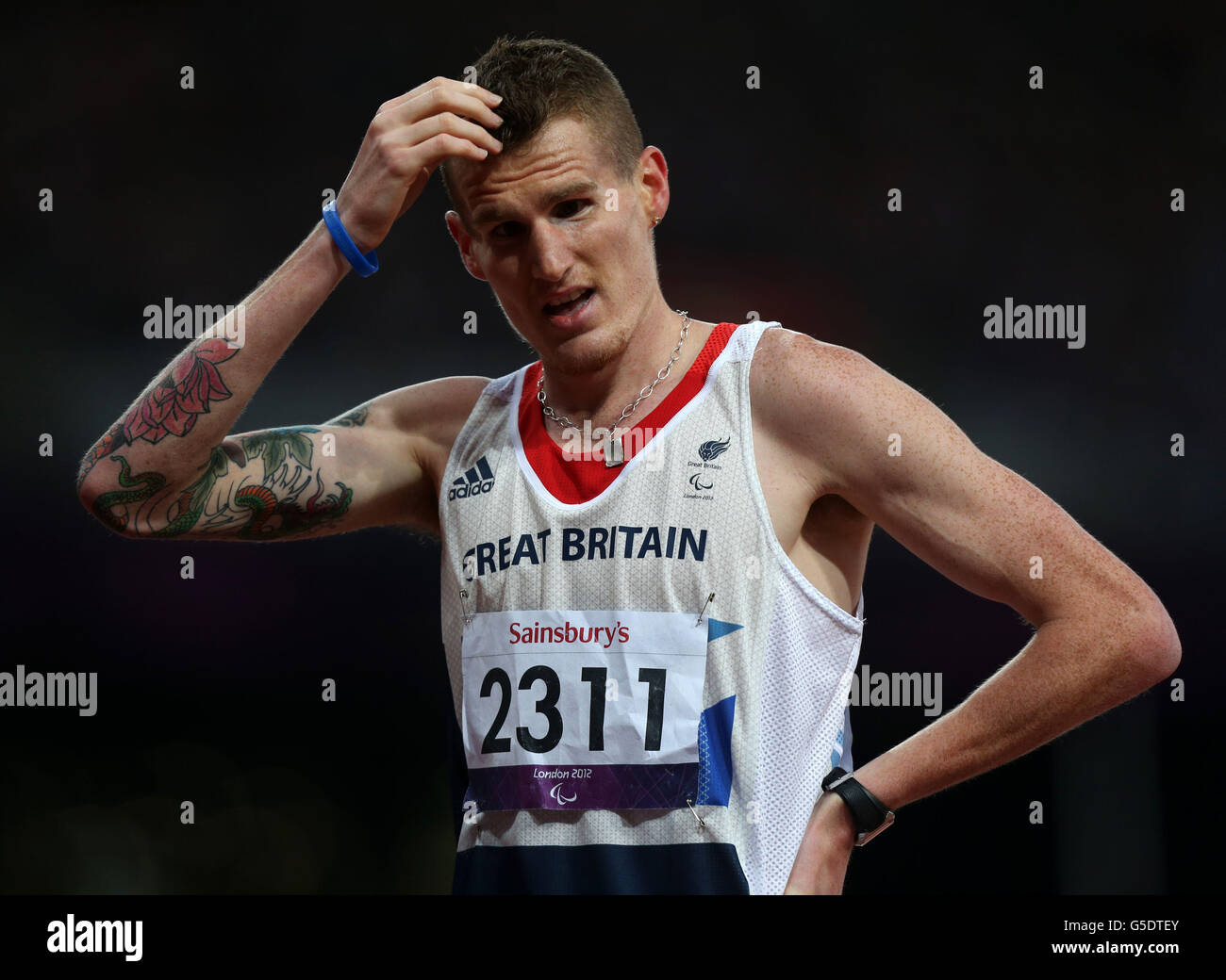 Great Britain's David Devine waits to find out his result, in which he won Bronze during the Men's 800m - T12 Final at the Olympic Stadium, London. Stock Photo