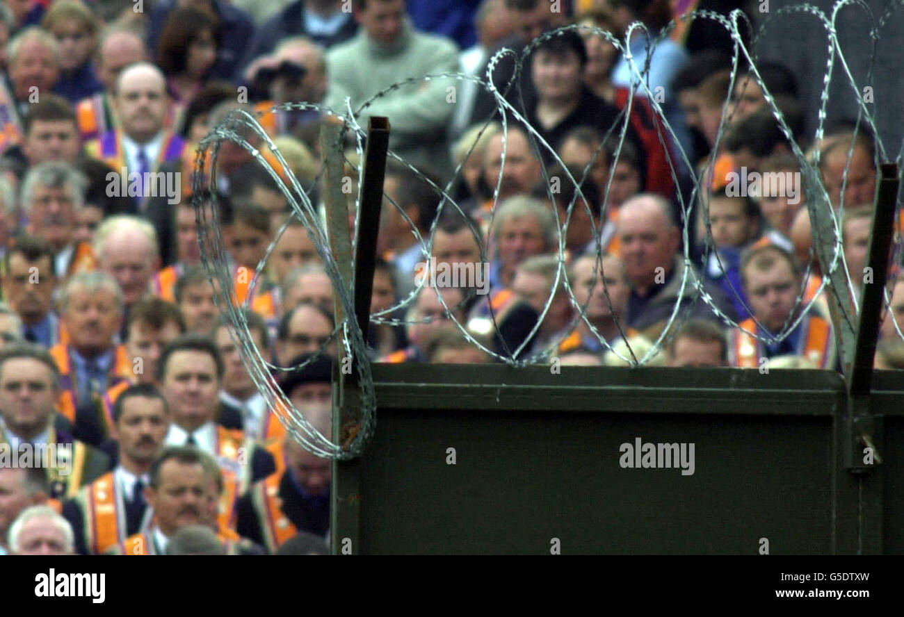 Grim faces on Orange Order Members and supporters are halted at a barrier erected by the security forces. They were prevented from marching from their Church Service at Drumcree along the Nationalist Garvaghy Road in Portadown, Ulster. Stock Photo